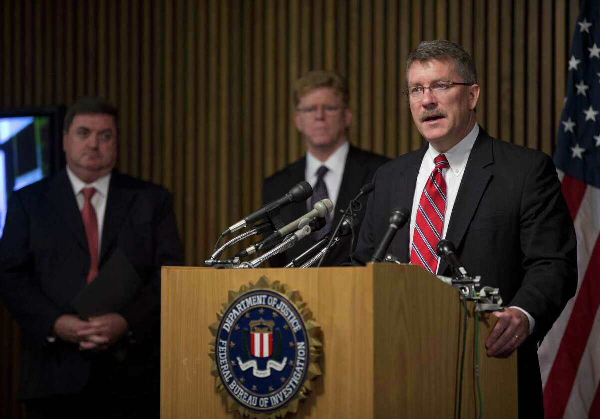 Ron Hosko, assistant director of the FBI's Criminal Investigative Division, right, speaks during a news conference at FBI headquarters in Washingotn, Monday, July 29, 2013, about "Operation Cross Country." The FBI says the operation rescued 105 children who were forced into prostitution in the United States and arrested 150 people it described as pimps and others in a series of raids in 76 American cities. From left are, John Ryan, CEO of National Center for Missing and Exploited Children, Drew Oosterbaan, chief of the DOJ Child Exploitation and Obscenity Section, and Hosko. (AP Photo/Evan Vucci) ORG XMIT: DCEV103