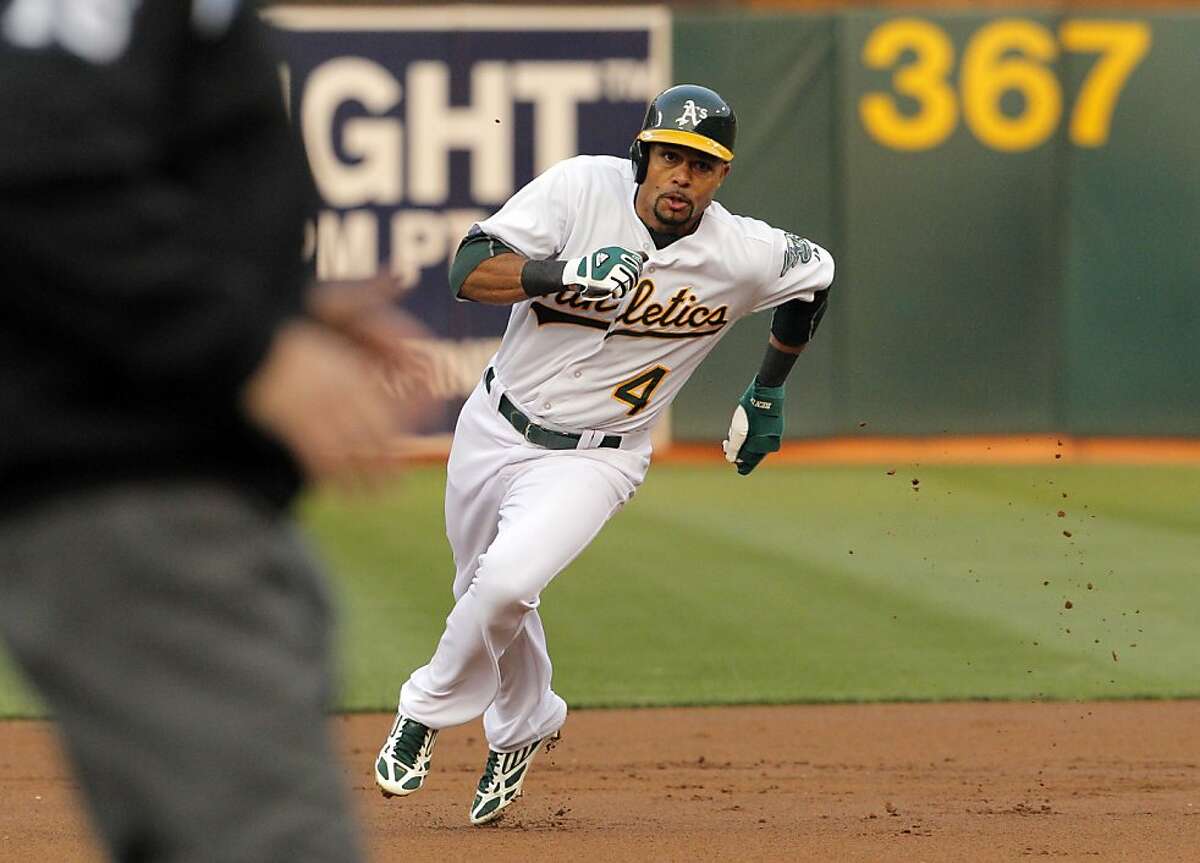 Coco Crisp rounds second on his way to third in the first inning. The Oakland Athletics played the Toronto Blue Jays at O.co Coliseum in Oakland, Calif., on Monday, July 29, 2013.