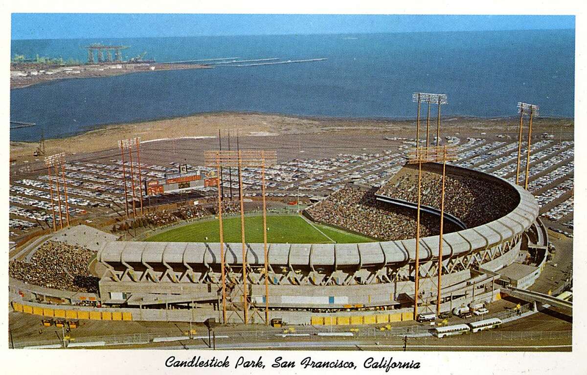 Vintage postcard showing a bird's eye view of Candlestick Park and the surrounding parking area. San Francisco Bay is in the distance. (Photo by Lake County Museum/Getty Images)