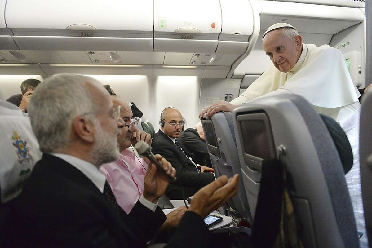 Pope Francis speaks during a news conference on the flight to Italy from Rio de Janeiro on July 29, 2013. Striking a conciliatory approach to a hot-button issue that has divided Catholics, Pope Francis on Monday said that he would not judge priests for their sexual orientation. (Luca Zennaro/Pool via The New York Times)