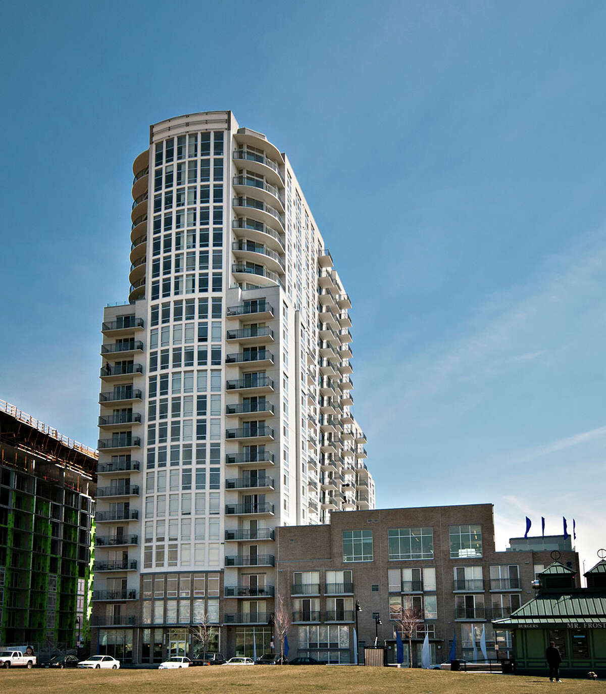 Shown is Building & Land Technology's Infinity Apartments at Harbor Point in Stamford. The 242-unit building was sold for $98.8 million to a company controlled by Clarion Partners.
