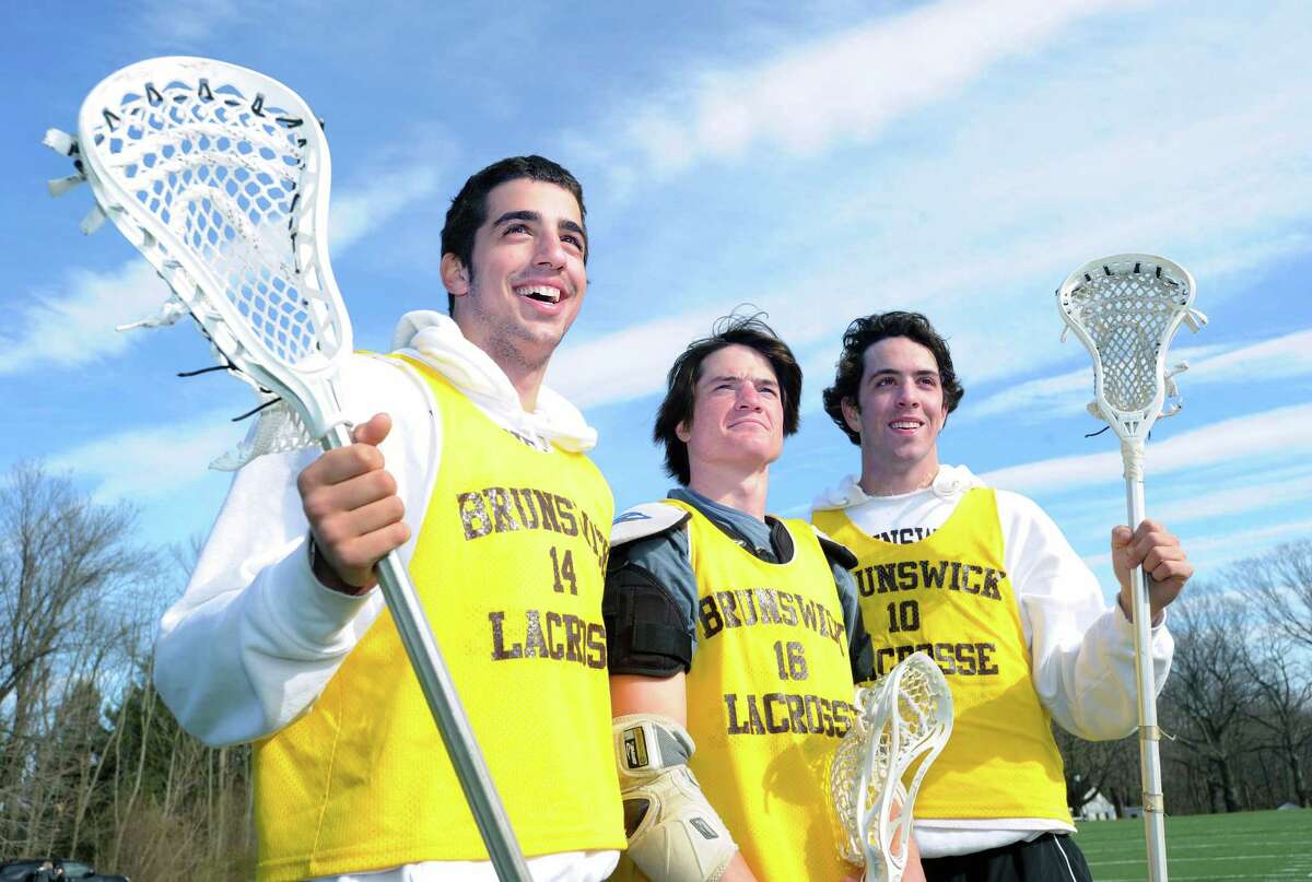 Brunswick School lacrosse captains, left to right, Brett Moscati, Sam Vallely and Jimmy Craft, posed at Cosby Field, Brunswick School, Friday afternoon, March 26th, 2010. 3/27/10 GT photo = Aiming high. Improving Bryunswick lacross targets success. by Christopher Falvo