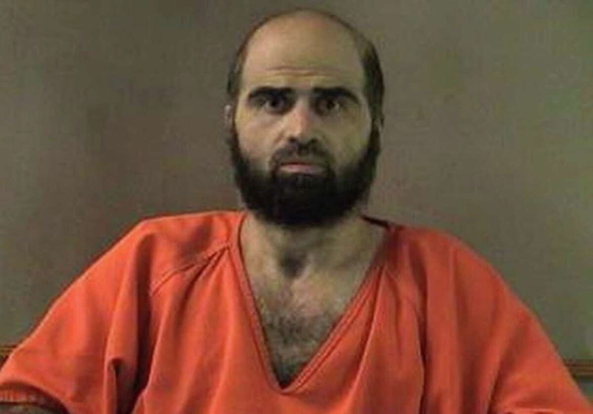 FILE - This undated file photo provided by the Bell County Sheriff's Department shows Nidal Hasan, the Army psychiatrist charged in the deadly 2009 Fort Hood shooting rampage that left 13 dead. The Army psychiatrist charged in the 2009 shooting rampage at Fort Hood is paralyzed from the waist down, after being shot by police. A judge has permitted him to represent himself at trial, but his compromised health means that his upcoming court martial will have shorter periods of testimony, more breaks and possible lengthy delays to write legal motions. (AP Photo/Bell County Sheriff's Department, File)