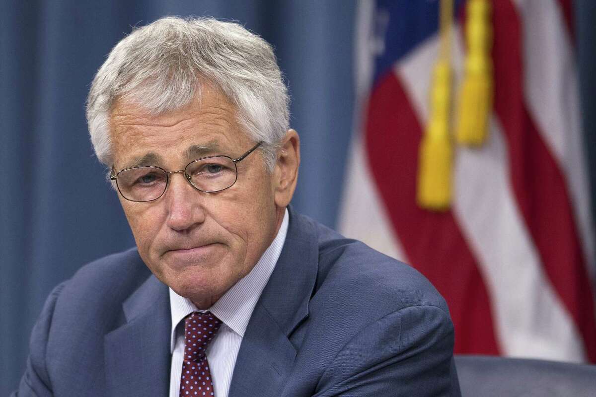 Defense Secretary Chuck Hagel warned Wednesday that budget cuts could force the Pentagon to mothball three Navy aircraft carriers and order more reductions in the Army and Marine Corps.