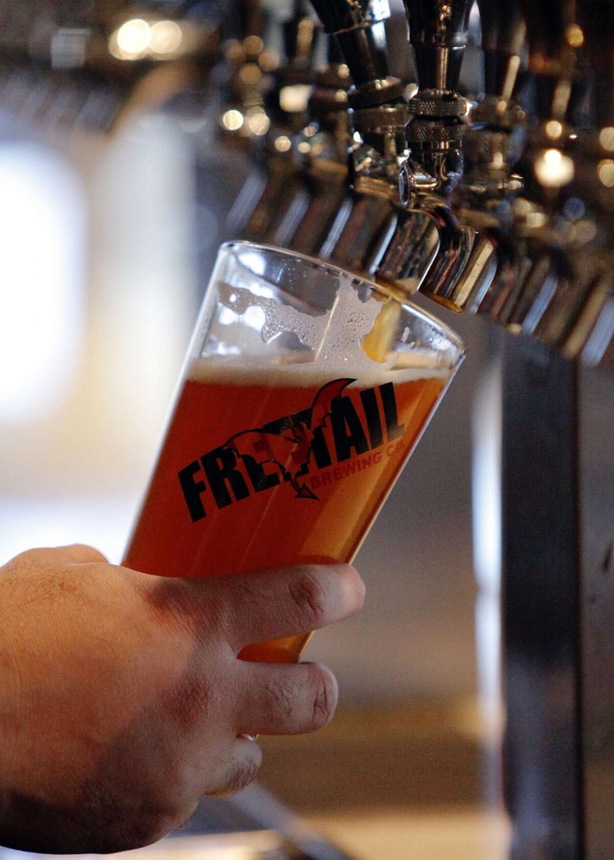 Beer being poured at the Freetail brew pub on the city's North Side.
