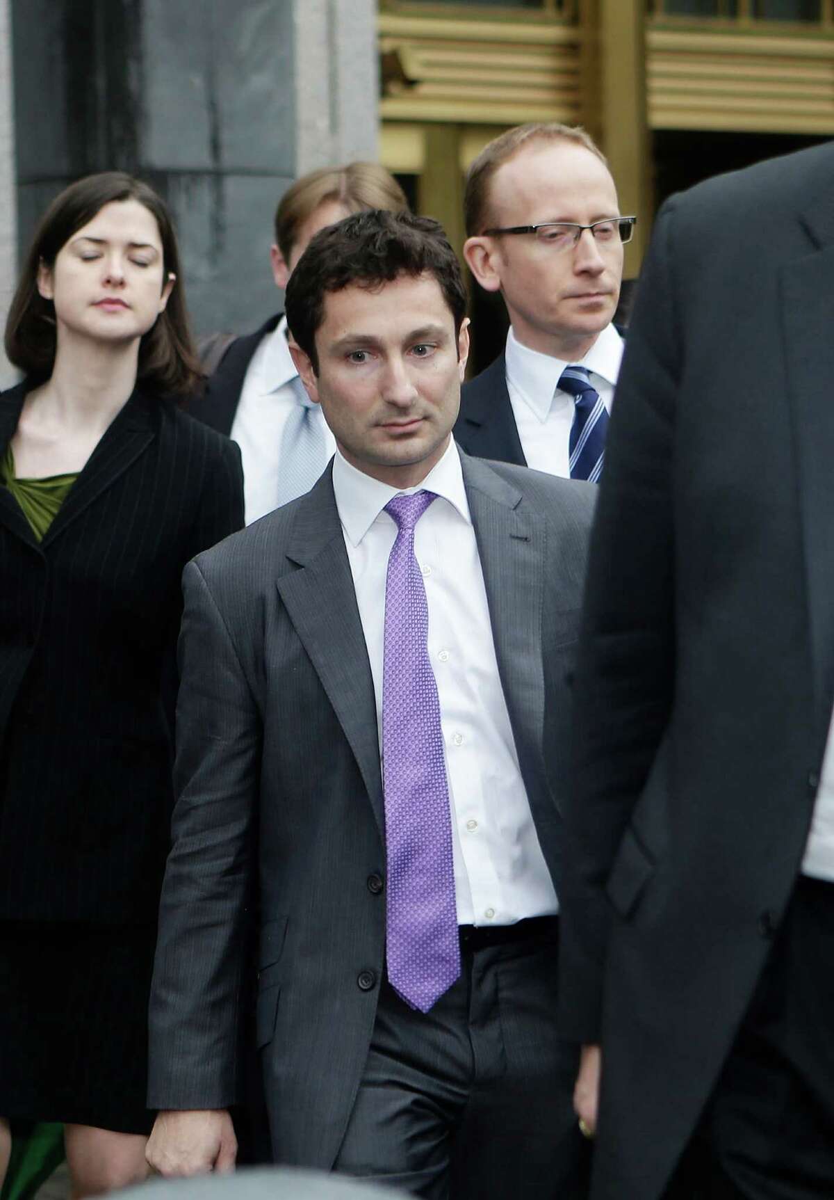 Former Goldman Sachs vice president Fabrice Tourre leaves Manhattan federal court with his attorneys, Thursday, Aug. 1, 2013, in New York. A New York City jury has found that the former trader known as "Fabulous Fab" is liable in a massive mortgage securities fraud case. (AP Photo/Frank Franklin II)