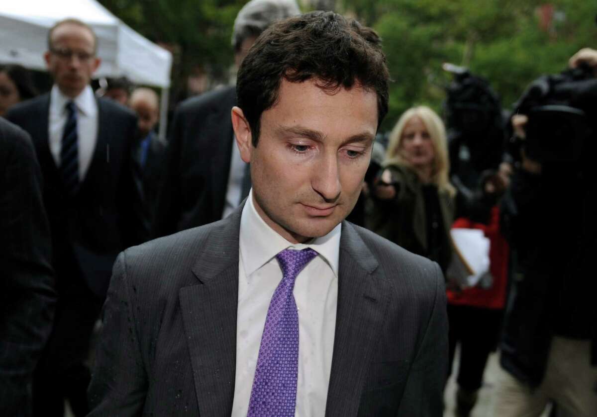 Fabrice Tourre, a former Goldman Sachs trader, leaves court Thursday after being found liable for civil securities fraud involving the 2008 financial crisis. He is now enrolled in a doctoral economics program at the University of Chicago.