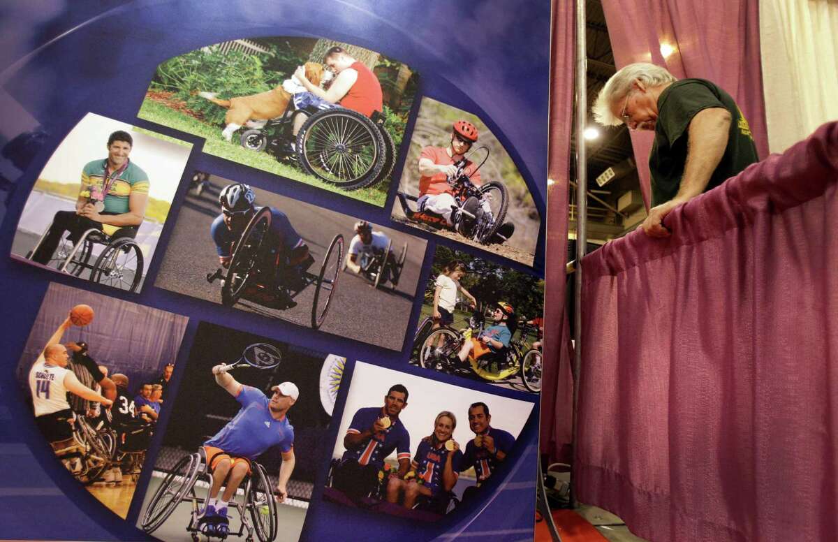 Larry Davis, of Cove, Texas, sets up the Invacare booth Thursday at the Abilities Expo. The company specializes in home and long-term-care medical products. The expo showcases services and equipment for the disabled.
