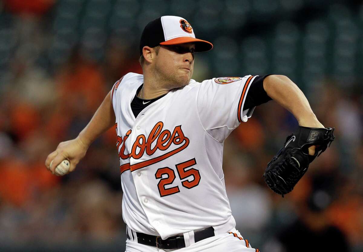 Bud Norris went six innings, giving up two runs, in his first game for the Orioles after being acquired from the Astros on Wednesday.