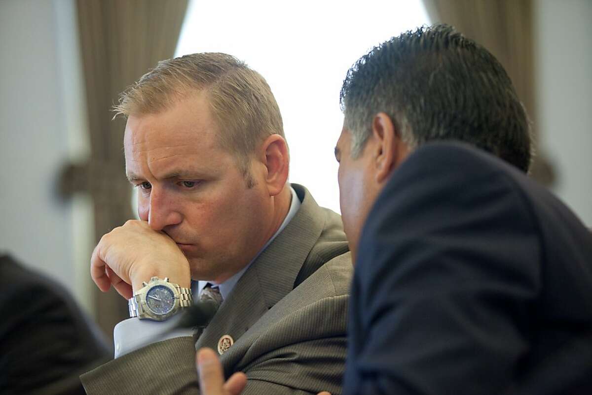 Congressman Jeff Denham (R-CA). left, and Congressman Tony Cardena (D-CA) hold a briefing on immigration reform in the Cannon House Office Building in Washington, DC on August 1, 2013.