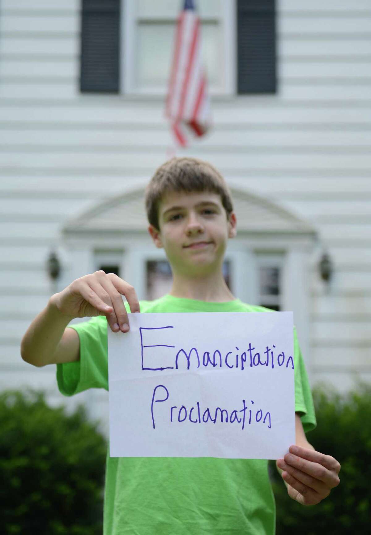 Thomas Hurley III, poses for a photo outside his home in Newtown, Conn. on Friday, August 2, 2013. The 12-year-old recently appeared on Jeopardy, spelling "Emancipation Proclamation" incorrectly, adding an extra "T," during Final Jeopardy. The judges disqualified Hurley's answer, despite show host Alex Trebek reading it correctly, costing him $3,000.