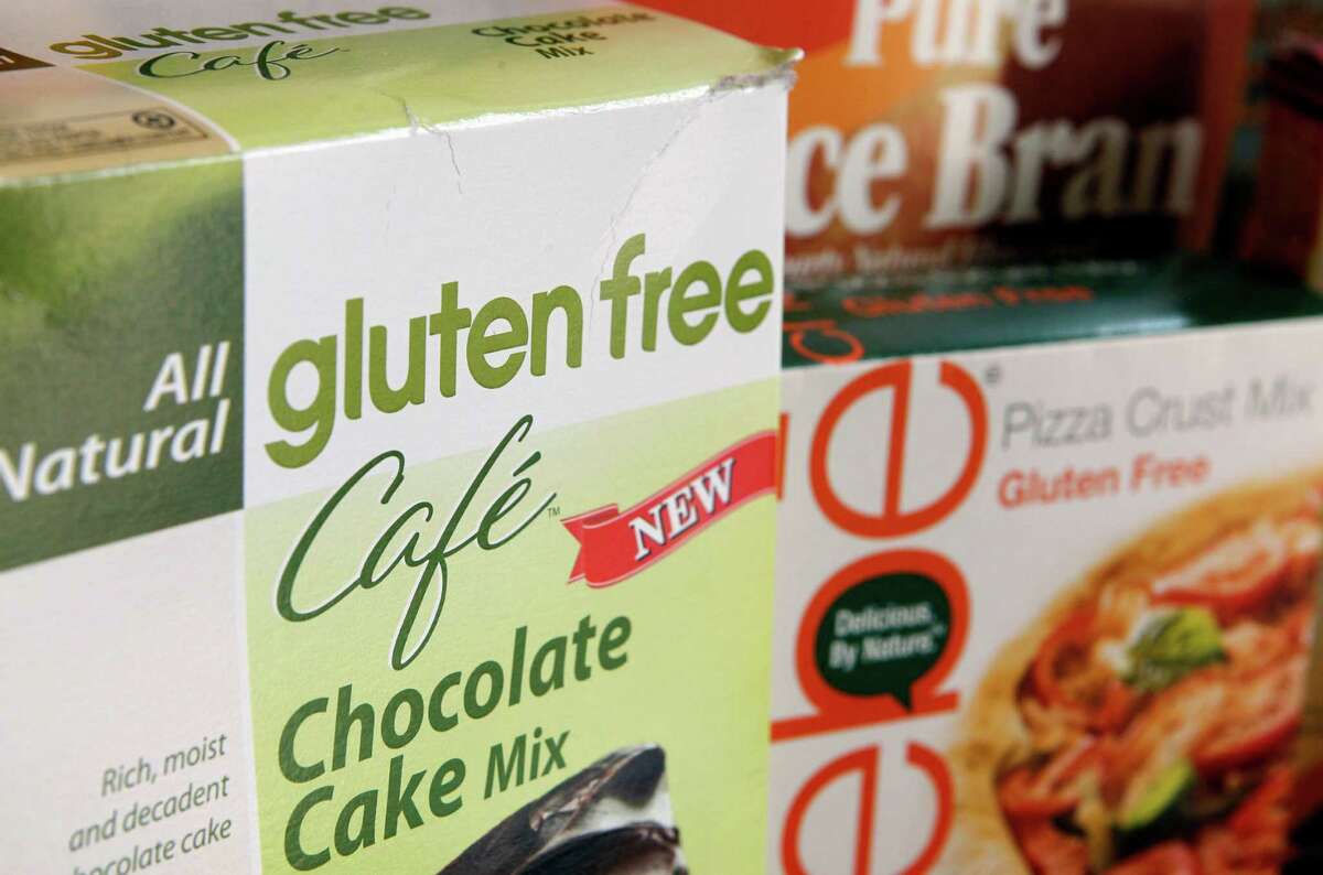 A variety of foods labeled Gluten Free are displayed in Frederick, Md., Friday, Aug. 2, 2013. Consumers are going to know exactly what they are getting when they buy foods labeled "gluten free." The Food and Drug Administration (FDA) is at last defining what a "gluten free" label on a food package really means after more than six years of consideration. Until now, manufacturers have been able to use their own discretion as to how much gluten they include. Under an FDA rule announced Friday, products labeled "gluten free" still won't have to be technically free of wheat, rye and barley and their derivatives. But they almost will: "Gluten-free" products will have to contain less than 20 parts per million of gluten. (AP Photo/Jon Elswick)