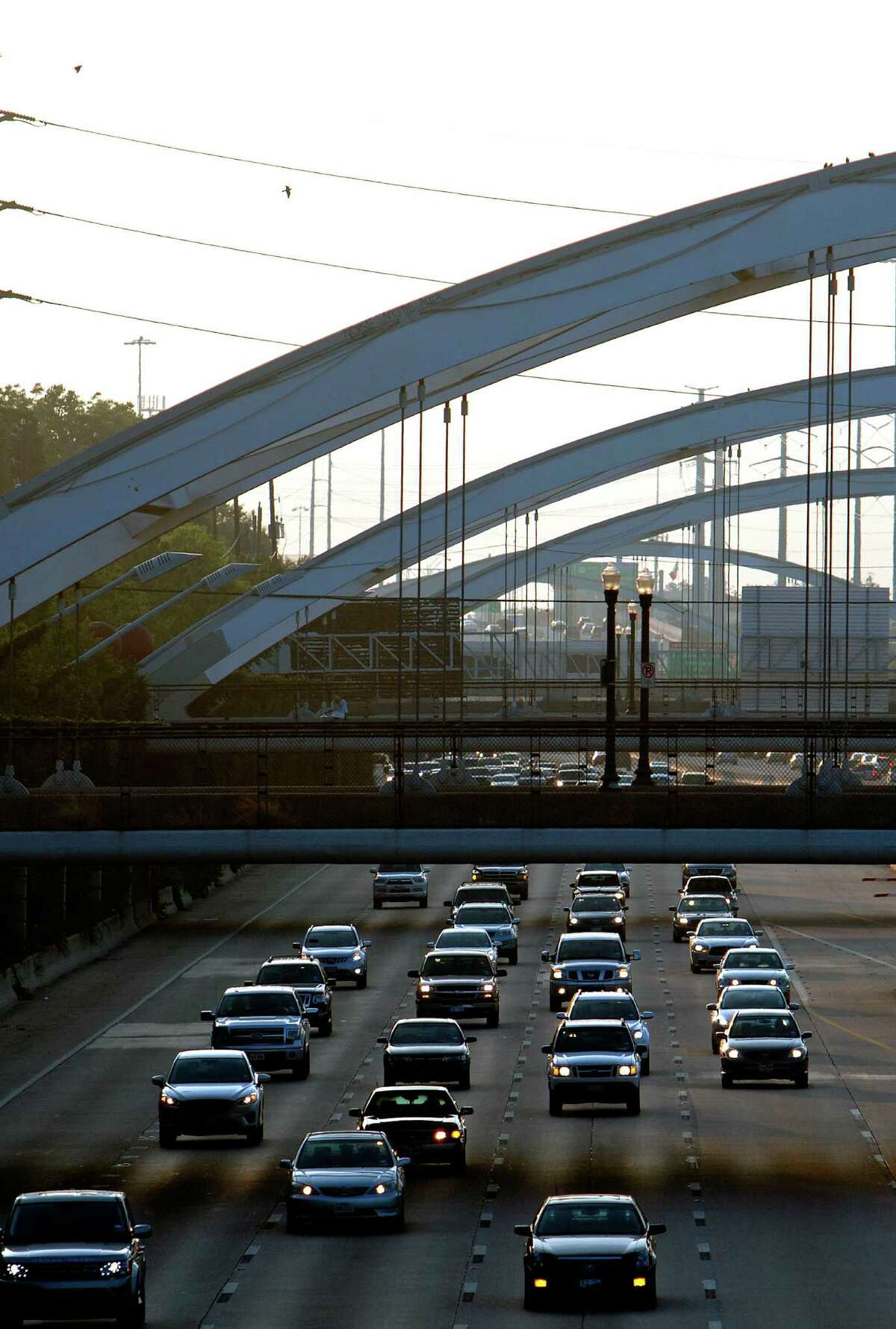 Lights over arch bridges over Southwest Freeway may sparkle again