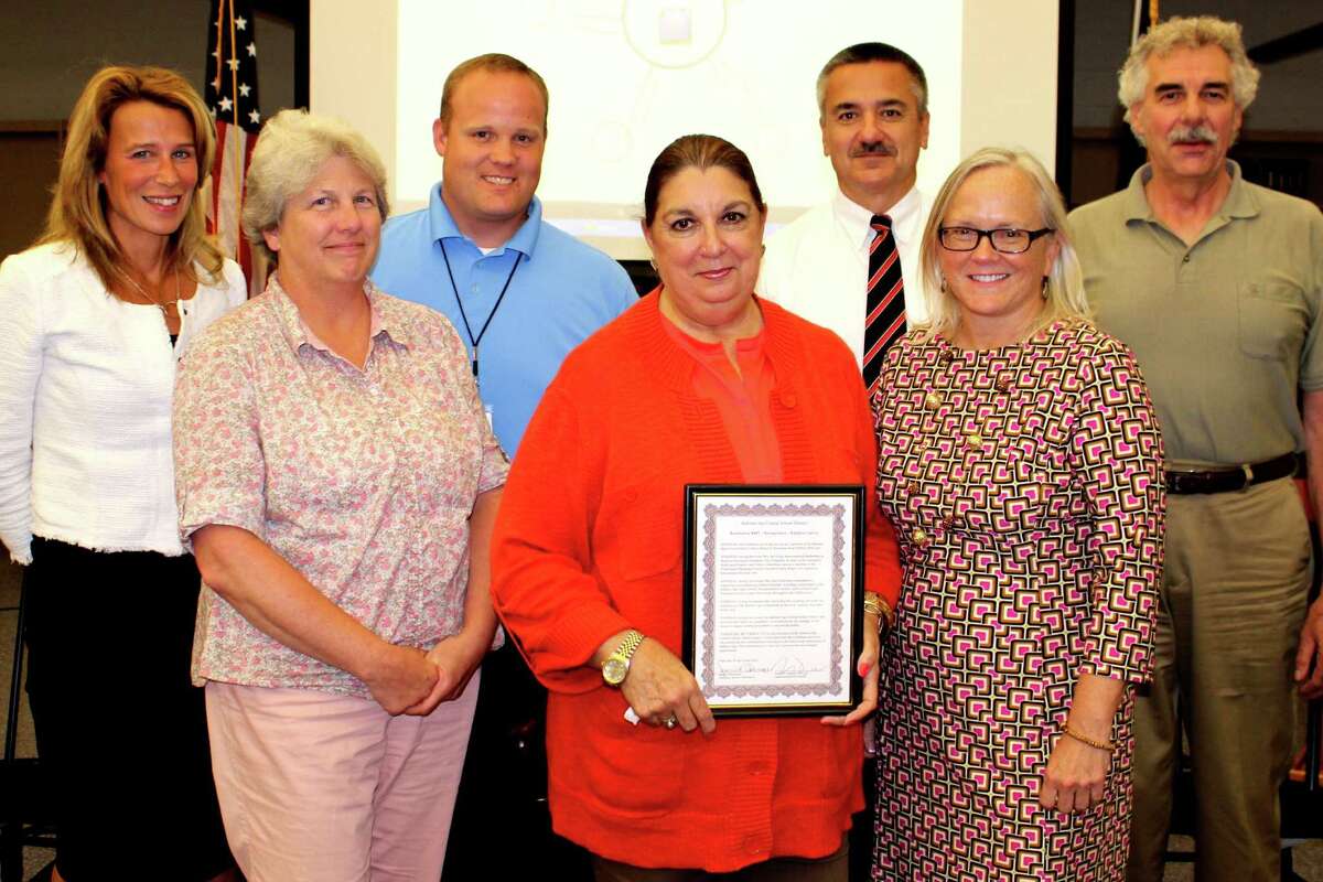 Retiring Ballston Spa Board of Education member Kathy Jarvis is honored for her dedication to the school district and recent leadership as board president. In front, from left, are Nancy Fodera, Kathy Jarvis, President Jeanne Obermayer. From left in back are Christine Richardson, Daniel Cramer, Vice President Kevin Schaefera and Frank Townley. (Submitted photo)