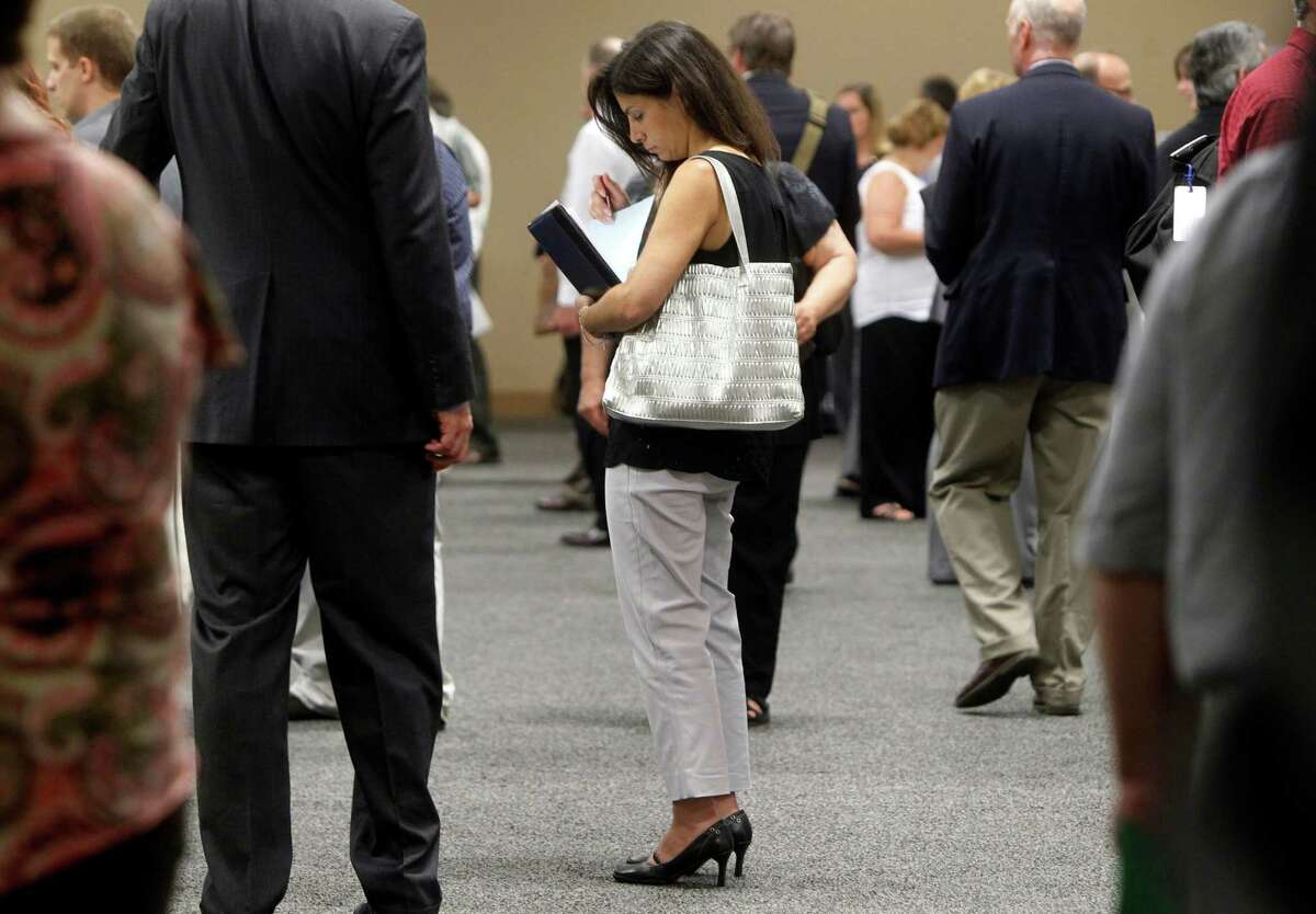 A job fair was held last month for laid-off IBM workers in South Burlington, Vt. The July U.S. unemployment rate fell to a 4½-year low of 7.4 percent.