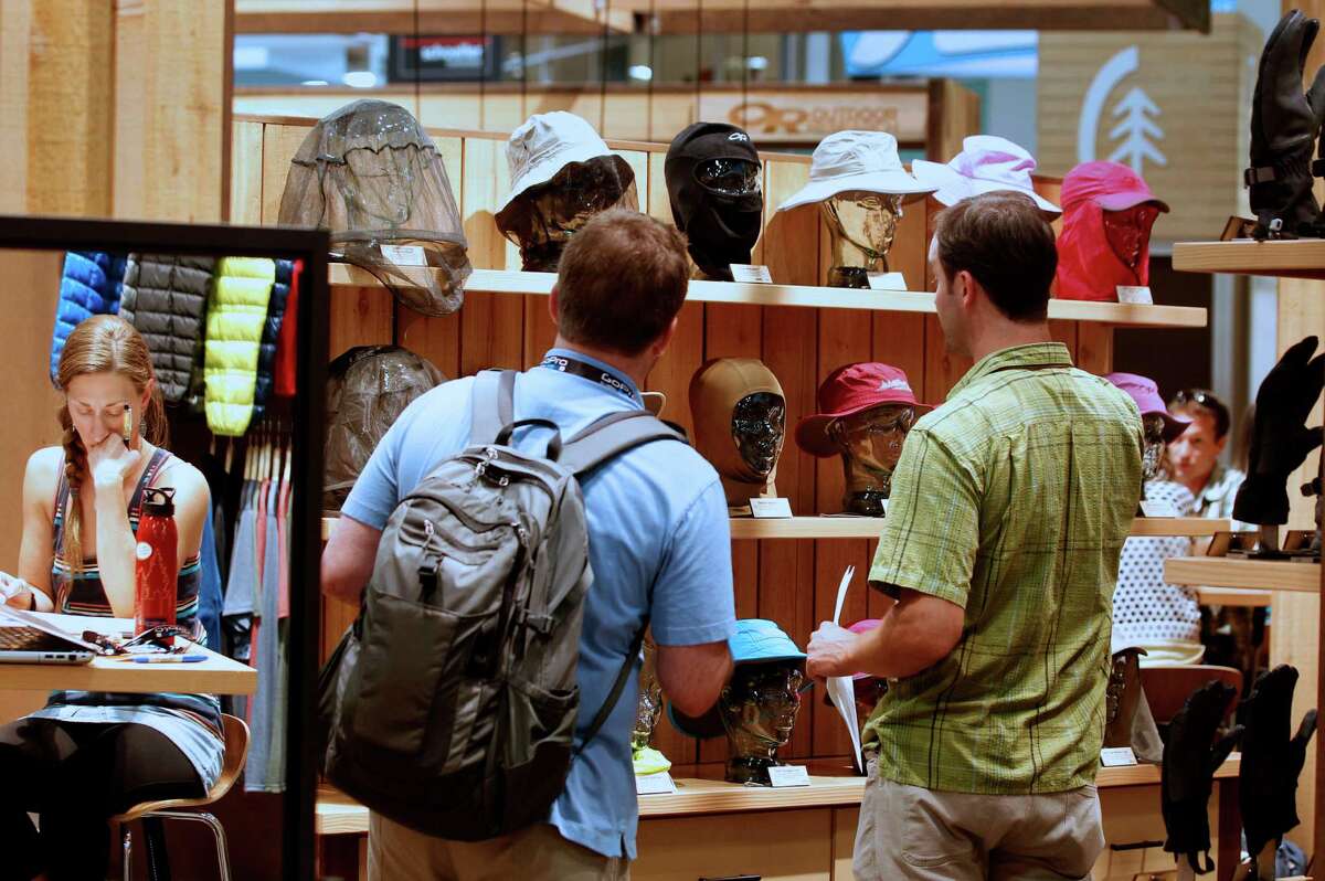 Attendees view accessories during the Outdoor Retailer Summer Market show in Salt Lake City.