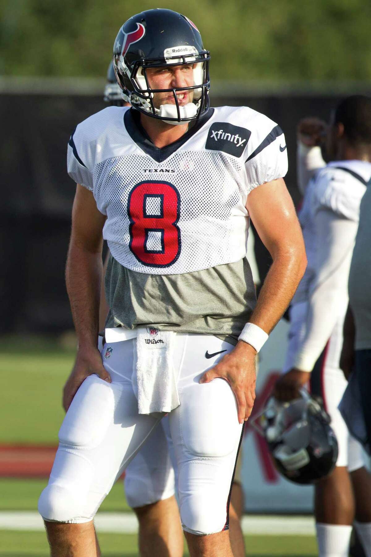 Houston Texans quarterback Matt Schaub gestures to his thigh pads at the beginning of practice during Texans training camp at the Methodist Training Center Monday, July 29, 2013, in Houston. NFL players are now required to wear thigh pads. ( Brett Coomer / Houston Chronicle )