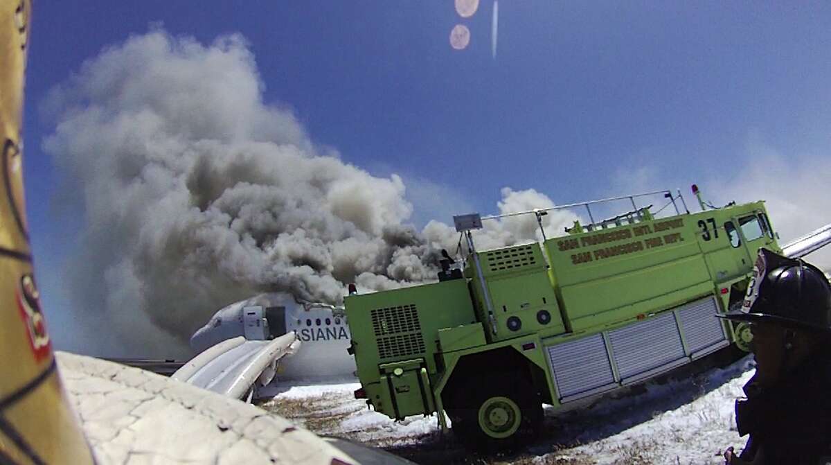 An image from the helmet-mounted video camera of a San Francisco fire battalion chief shows the moment firefighting rig Rescue 37 struck the body of Ye Meng Yuan, 16, (obscured) as it was leaving the scene of the crash of Asiana Flight 214 to retrieve more water at San Francisco International Airport on July 6, 2013 in San Francisco, California.