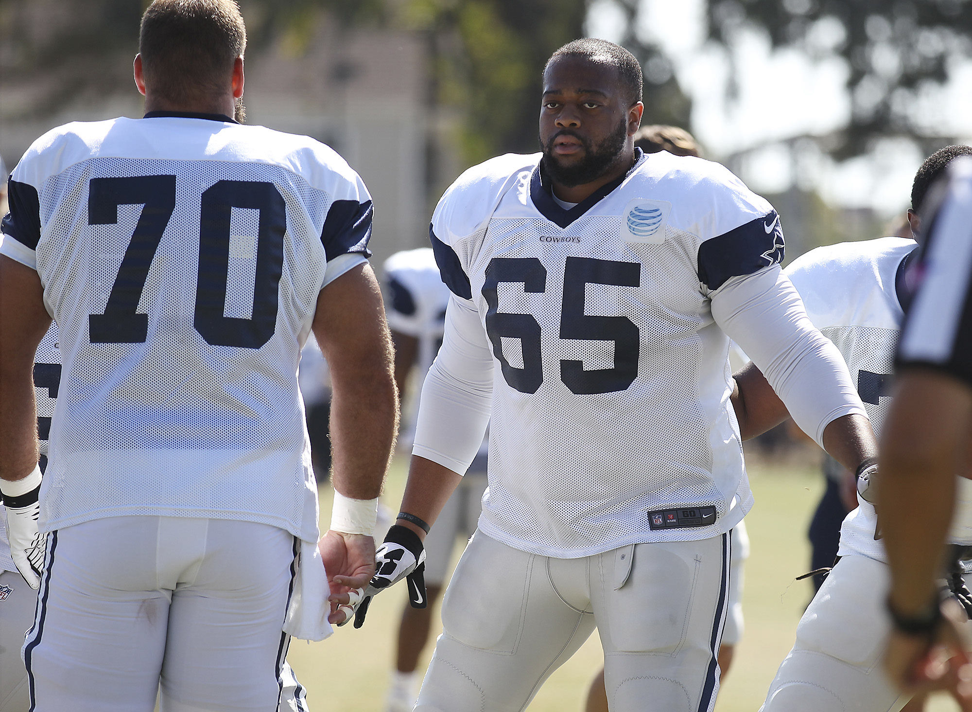 Dallas Cowboys Football Players Standing Together in Uniforms