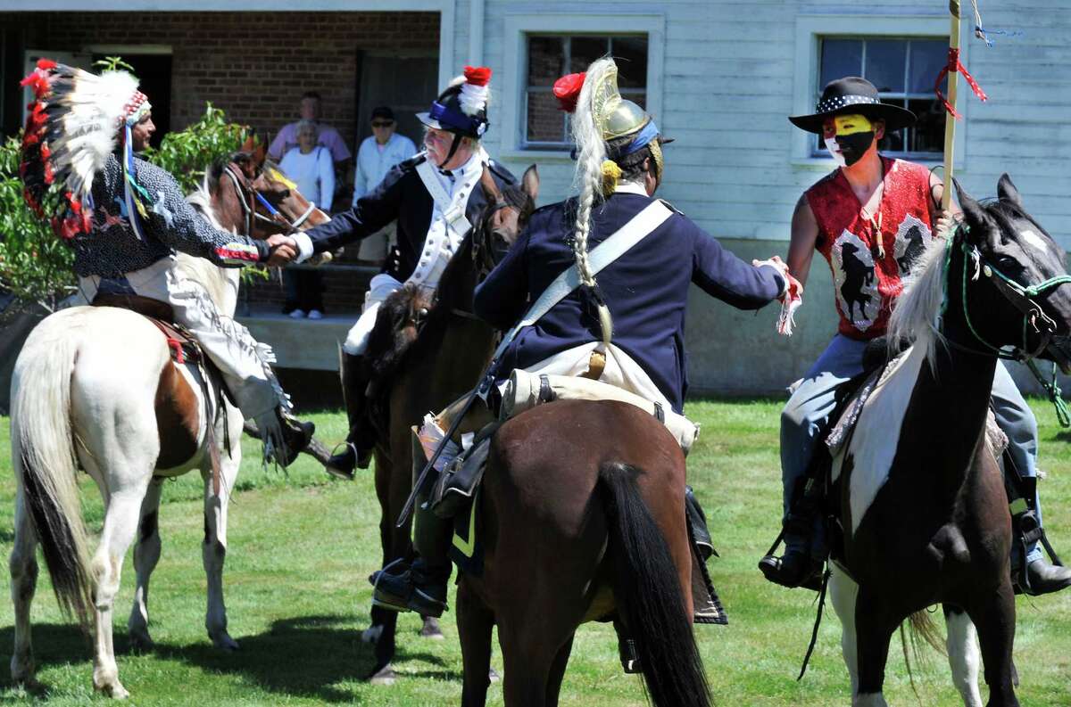 Sioux ride with horse guard in Newtown