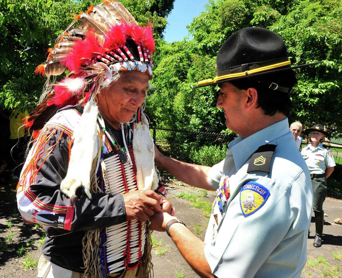Sioux ride with horse guard in Newtown