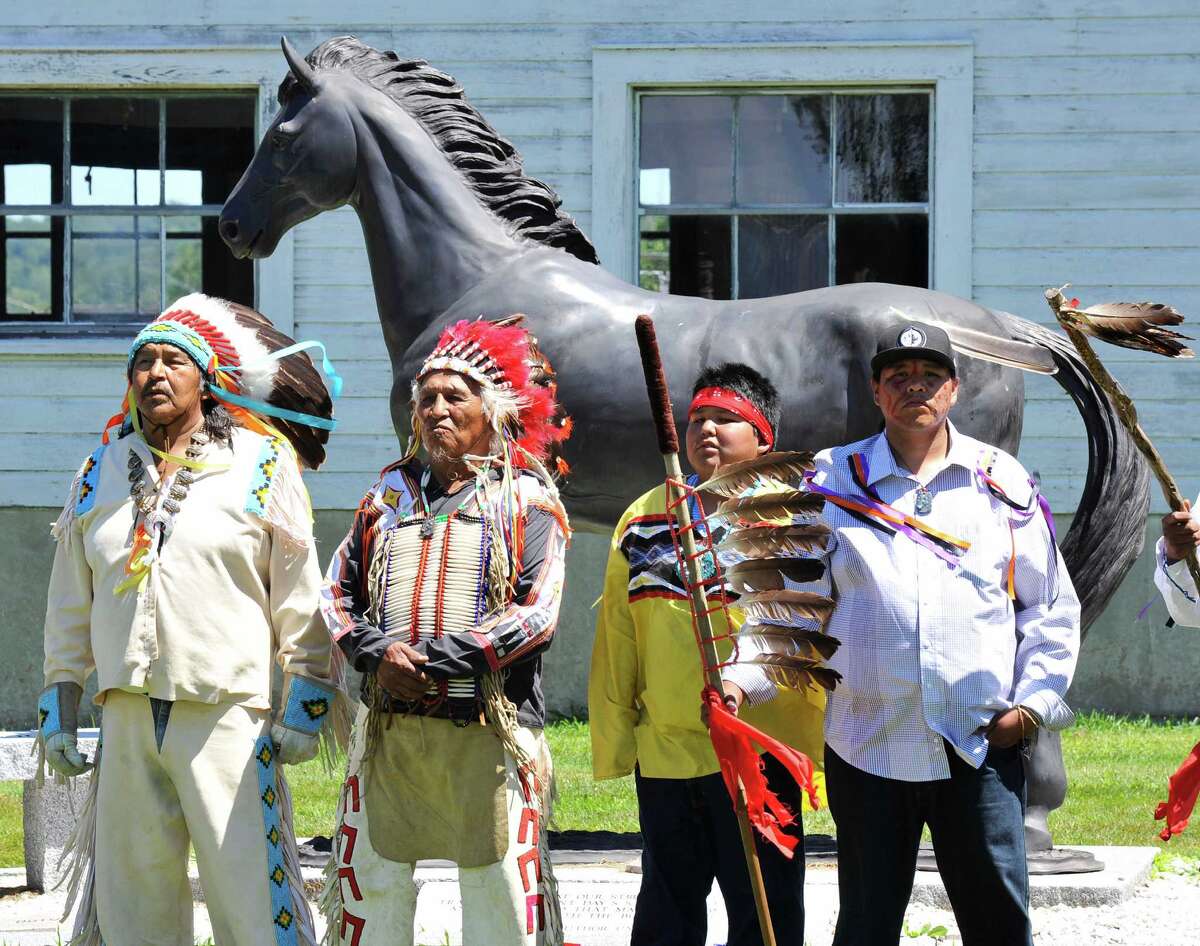 Sioux ride with horse guard in Newtown