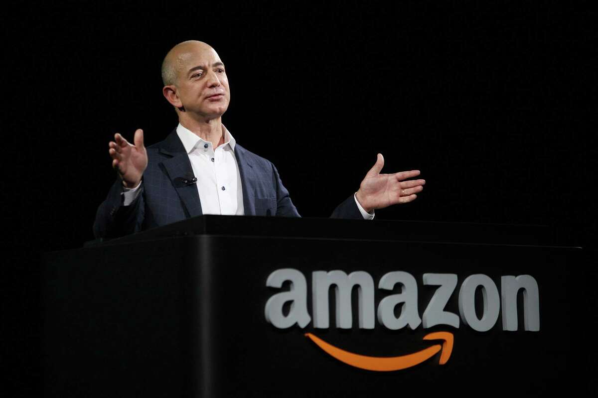 FILE - AUGUST 5, 2013: It was reported that the Washington Post Co. has agreed to sell its flagship newspaper to Amazon.com founder and chief executive Jeff Bezos for $250 million August 5, 2013. SANTA MONICA, CA - SEPTEMBER 6: Amazon CEO Jeff Bezos unveils new Kindle reading devices at a press conference on September 6, 2012 in Santa Monica, California. Amazon unveiled the Kindle Paperwhite and the Kindle Fire HD in 7 and 8.9-inch sizes. (Photo by David McNew/Getty Images)
