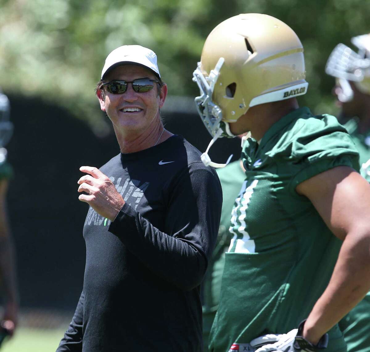 Coach Art Briles (left) has changed Baylor's perception as a perennial doormat to a team that has three consecutive bowl trips and boasts 2011 Heisman Trophy winner Robert Griffin III.