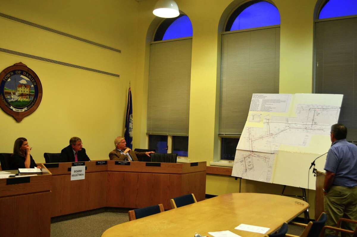 Director of Public Works Robert Steeger, far right, provides First Selectman Jayme Stevenson, from left, and Selectman David Bayne and John Lundeen with a presentation of the Intervale Drainage Project at the Monday, August 6 Board of Selectmen meeting.