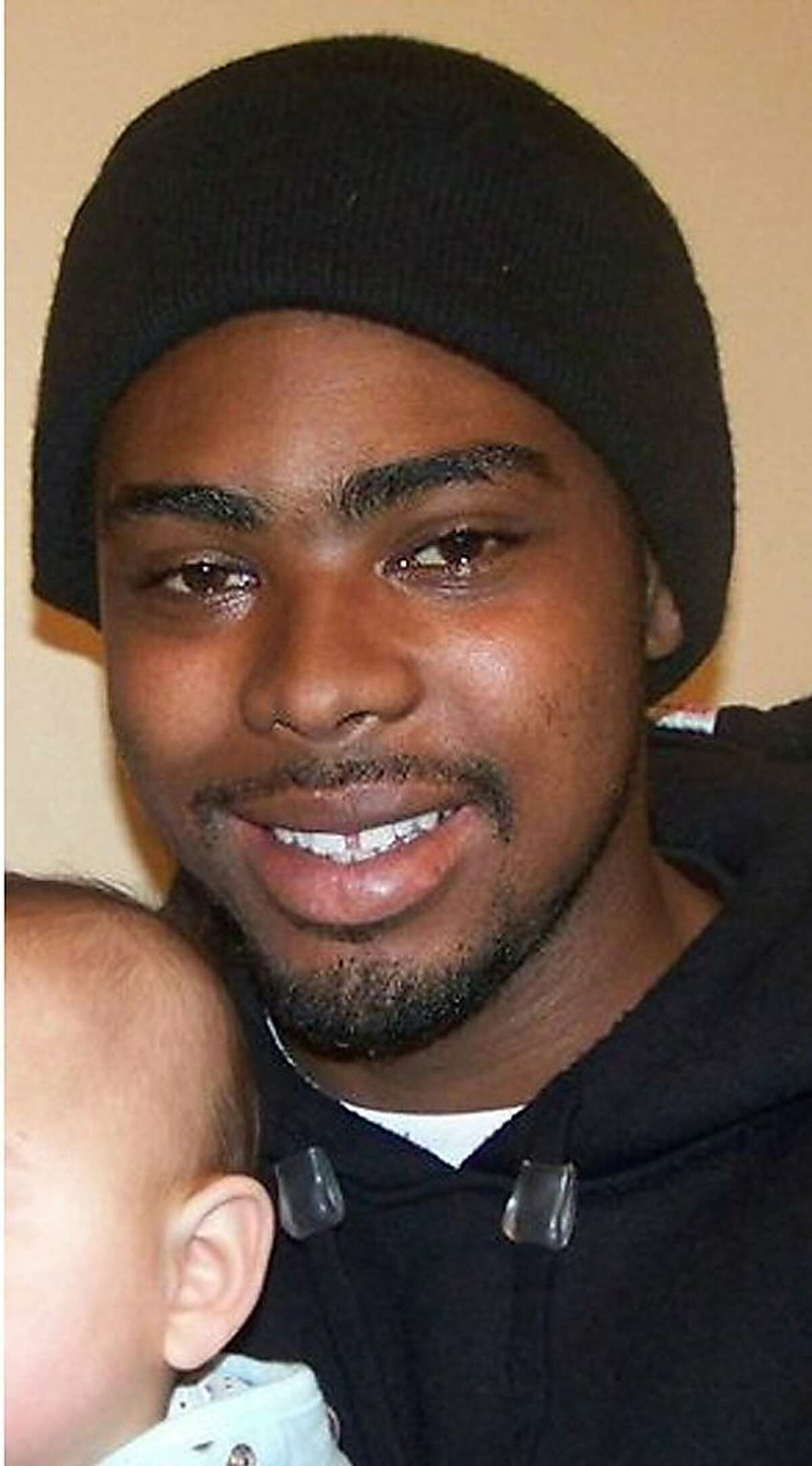 FILE - This undated family photo provided by the Law Offices of John Burris shows Oscar Grant, a 22-year-old transit rider who was shot and killed by Bay Area Rapid Transit police on New Year's Day 2009.