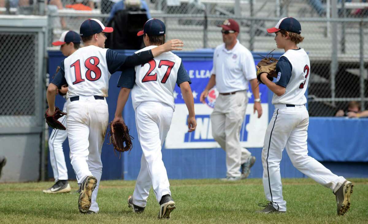 Westport pitchers Harry Azadian, left, and Chad Knight run off the field after their win over Sacro/Maremont, of Maine, in the Little League Baseball Eastern Regional Tournament game at Breen Field in Bristol, Conn. Thursday, August 8, 2013.