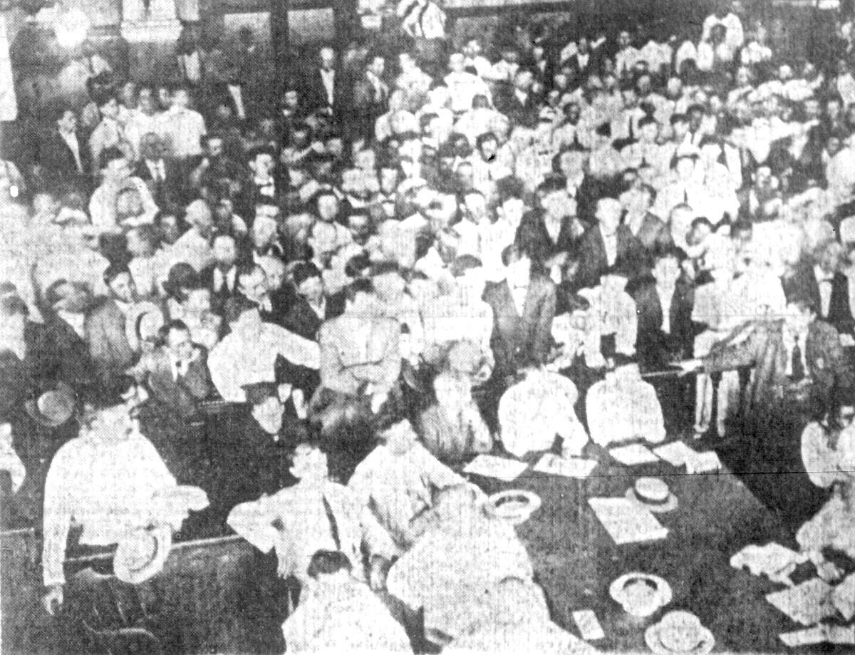 This photo, published August 23, 1913, San Antonio Express,of the packed double-height courtroom during the 1914 murder trial of Lee Johnson, was the only photo of the courtroom's interior that Fisher Heck Architects found to help them restore the room to its 1897 splendor. About 1,500 people were said to have attended the trial, but from the crowded photograph, architect Lewis Fisher was able to pick out a wall sconce, a railing, a wainscot and a pilatster, or column built into the wall.