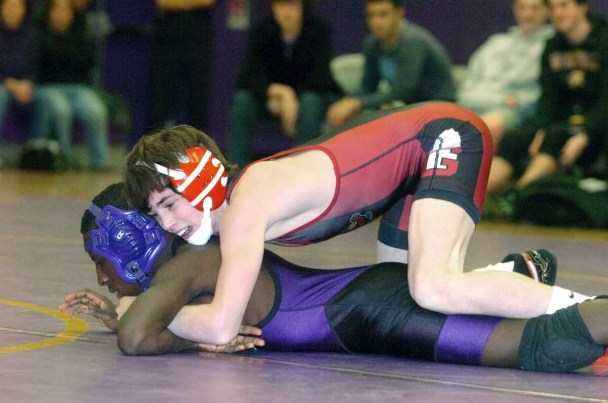 Greenwich's Johnny D'Elia takes on Westhill's Pascal Medor to win the 103 pound division as Westhill High hosts Greenwich in a wrestling match Wednesday, January 20, 2010.