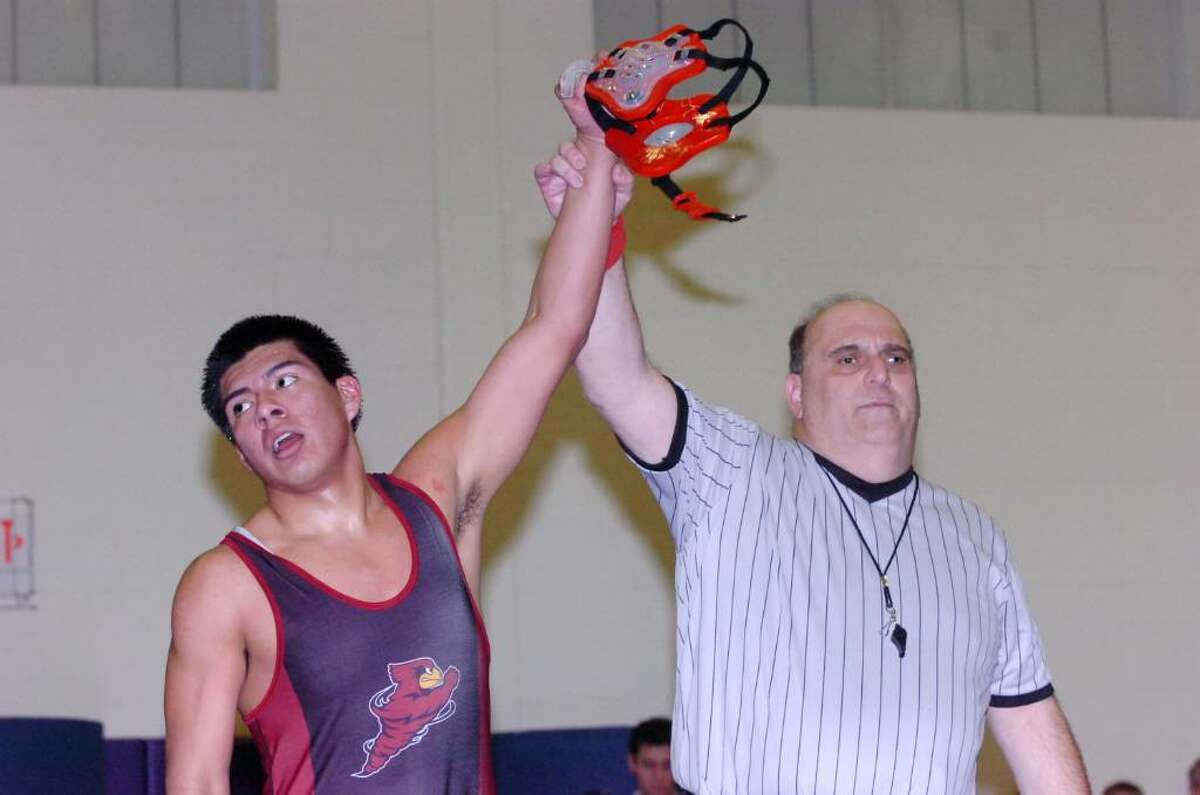 Greenwich's Miguel Gomez takes the win in the 171 pound division as Westhill High hosts Greenwich in a wrestling match Wednesday, January 20, 2010.