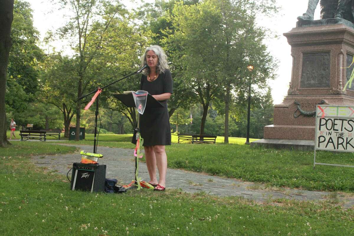 Poet Melissa Tuckey reads from her work in Albany?s Washington Park this summer. The reading was part of the annual Poets in the Park series originated by Tom Nattell in 1989 and sponsored by the Poetry Motel Foundation and the Hudson Valley Writers Guild. Tuckey lives in Ithaca and is one of the co-founders of the Split This Rock Poetry Festival held every other year in Washington, D.C. (Dan Wilcox)