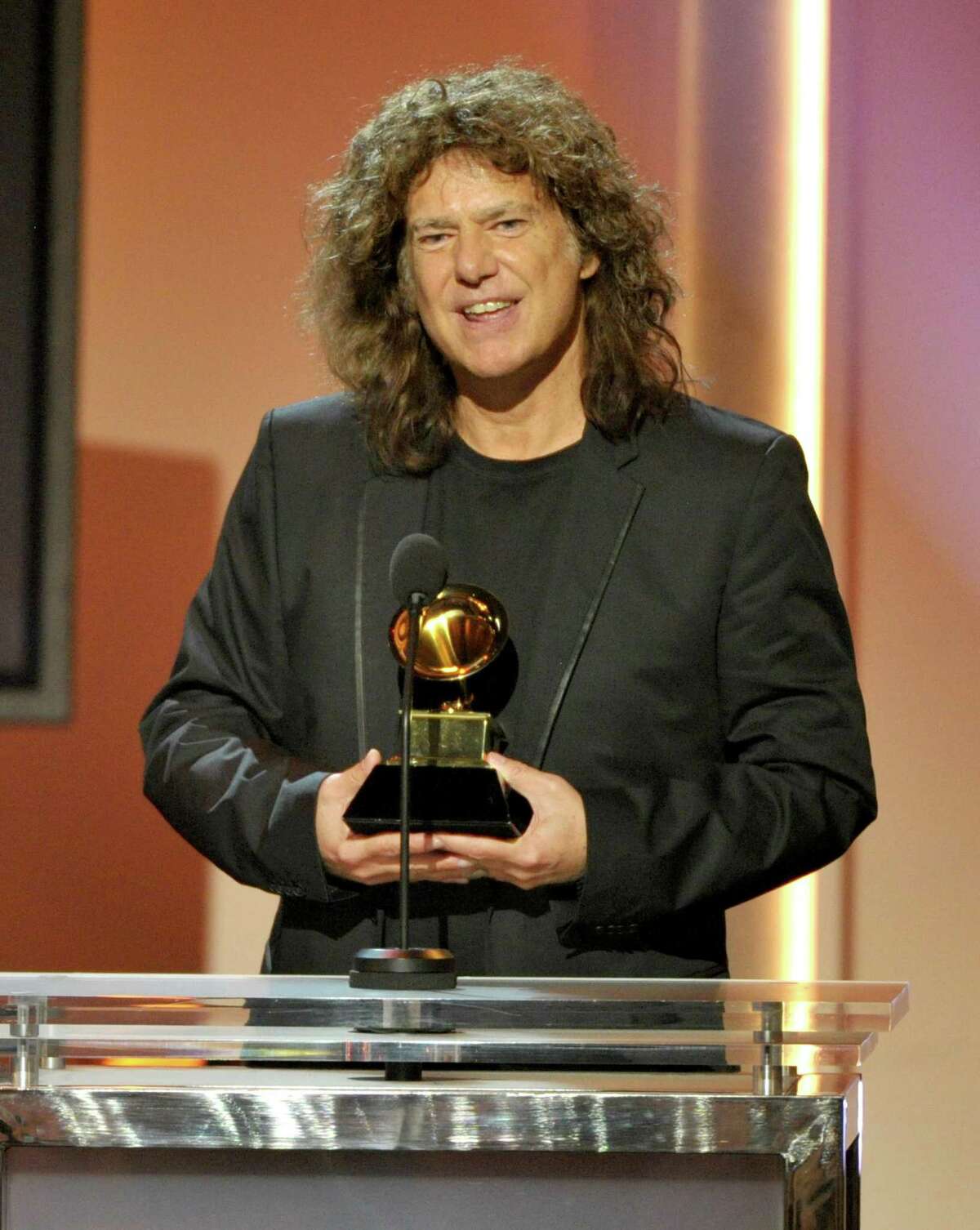 Pat Metheny accepts the jazz instrumental album award for "Unity Band" at the 55th annual Grammy Awards on Sunday, Feb. 10, 2013, in Los Angeles. (Photo by John Shearer/Invision/AP)