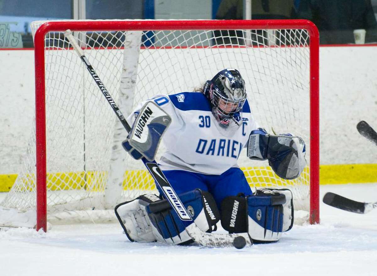 Darien's Katharine Macomber makes a save during a girls hockey game against New Canaan in Darien, Conn. on Wednesday, Jan. 20, 2010