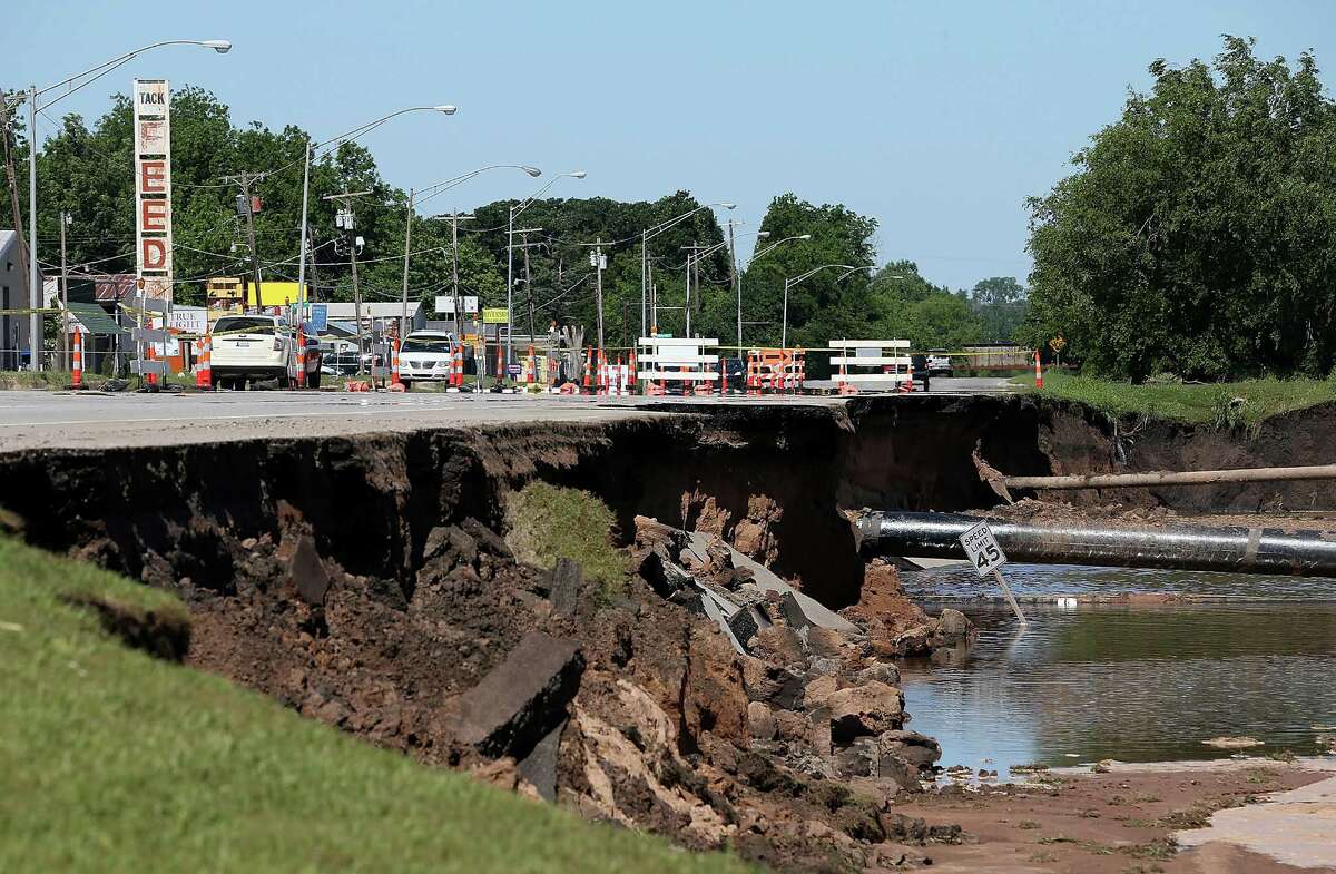 Flash flooding leaves a massive sinkhole on Route 62 June 2, 2013 in Oklahoma City, Oklahoma. A series of tornadoes ripped through the area on the evening of March 31st causing flash flooding, killing at least nine people, injuring many others and destroying homes and buildings.