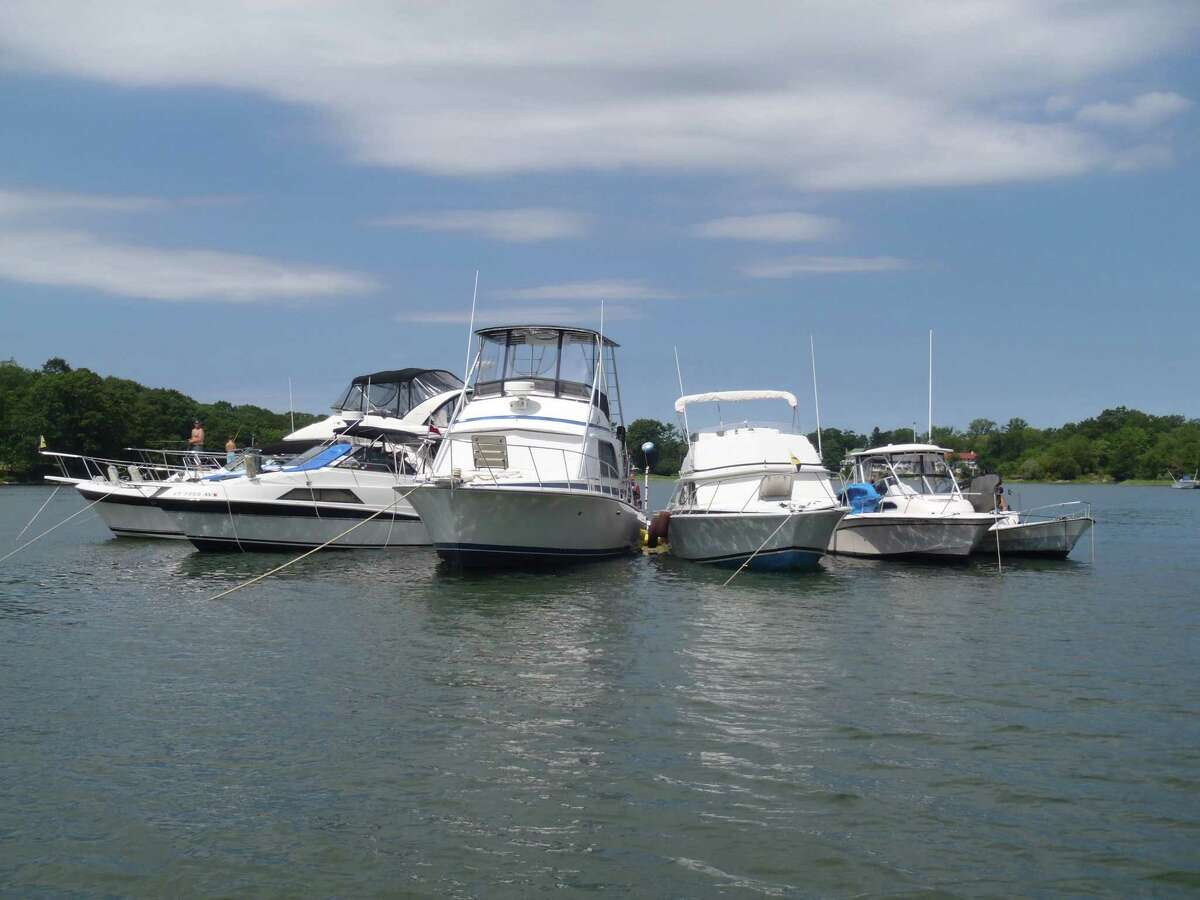 This photograph taken by Greenwich Harbormaster Ian MacMillan shows several boats around the mooring of former Greenwich police officer Peter Silbereisen on Sunday August 11, 2013. Some Windrose Way residents, who maintain the channel where the mooring is located, say it is difficult to navigate the channel when Silbereisen and others congregate at the mooring.
