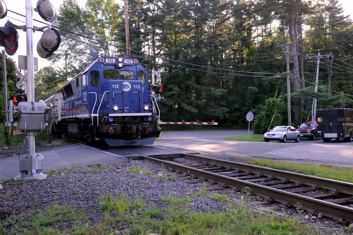 Protective gates are now in place at the Long Ridge Road railroad crossing in West Redding, Conn., where two people lost their lives and two others were injured last December. Monday, August 12, 2013.