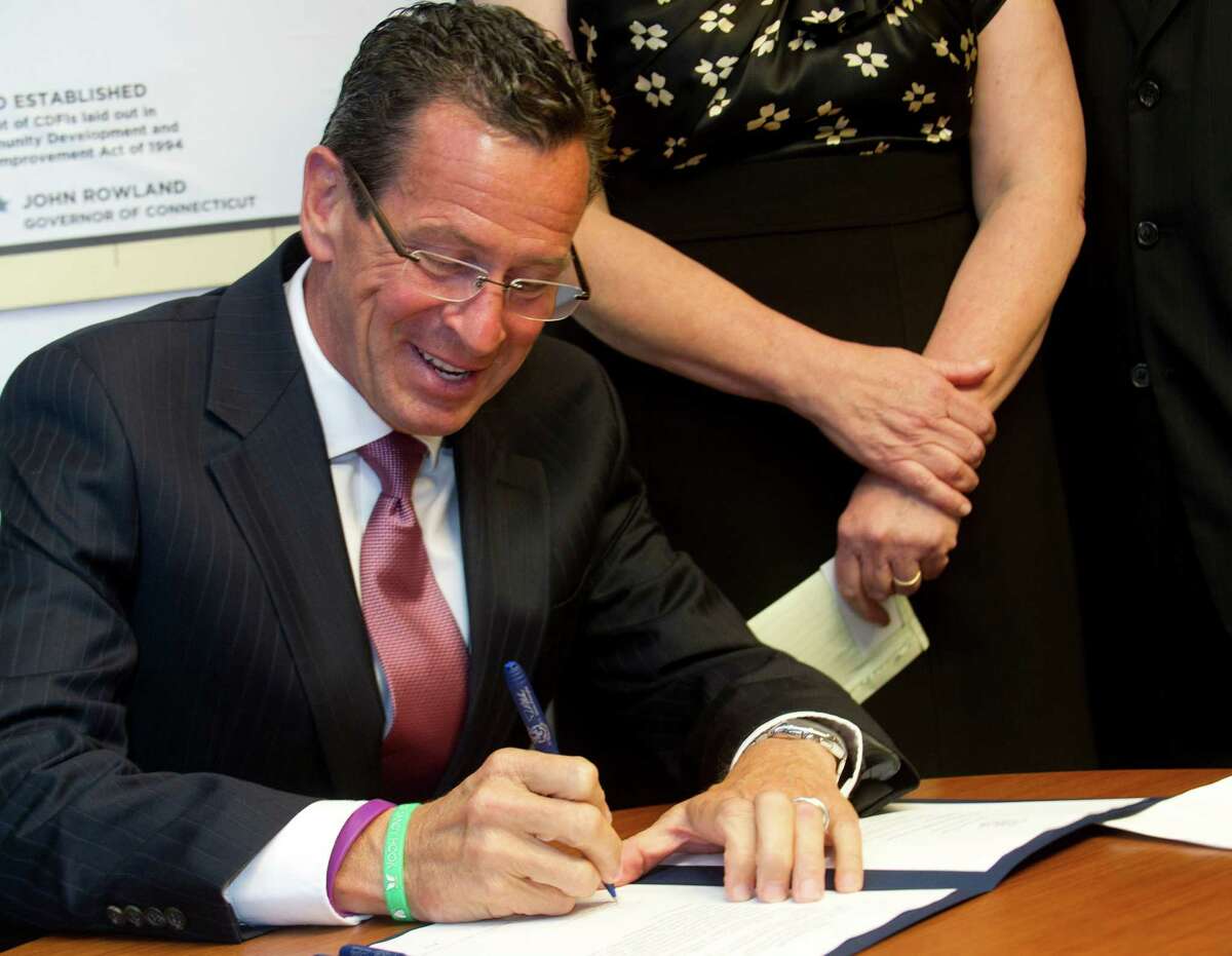 Connecticut Governor Dannel Malloy speaks during a bill-signing ceremony for a law regarding protections for homeowners facing foreclosure at the Housing Development Fund offices in Stamford, Conn., on Tuesday, August 13, 2013.