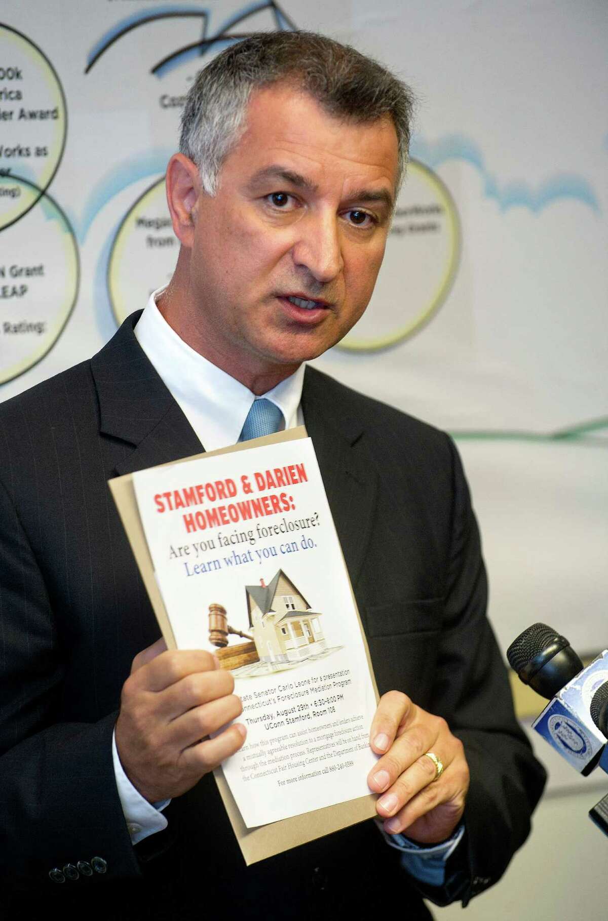 State Senator Carlo Leone speaks during a bill-signing ceremony for a law regarding protections for homeowners facing foreclosure at the Housing Development Fund offices in Stamford, Conn., on Tuesday, August 13, 2013.
