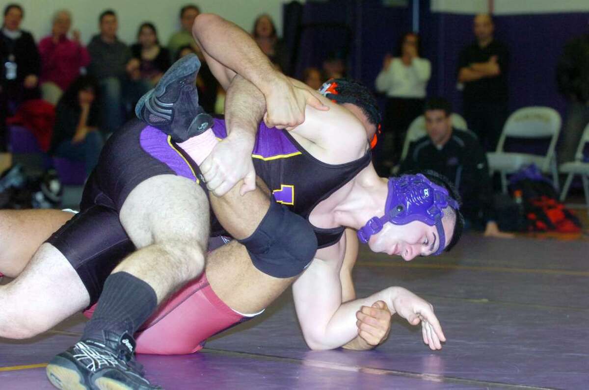 Westhill's Cosmo Ladanza wrestles Greenwich's Montel Williams to win the 189 pound division as Westhill High hosts Greenwich in a wrestling match Wednesday, January 20, 2010.