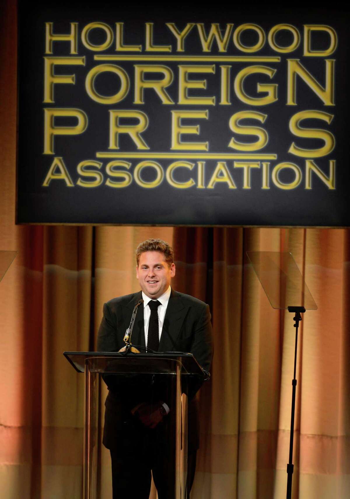 Jonah Hill speaks on stage at the Hollywood Foreign Press Association Luncheon at the Beverly Hilton Hotel on Tuesday, Aug. 13, 2013, in Beverly Hills, Calif. (Photo by Chris Pizzello/Invision/AP) ORG XMIT: CAPM151