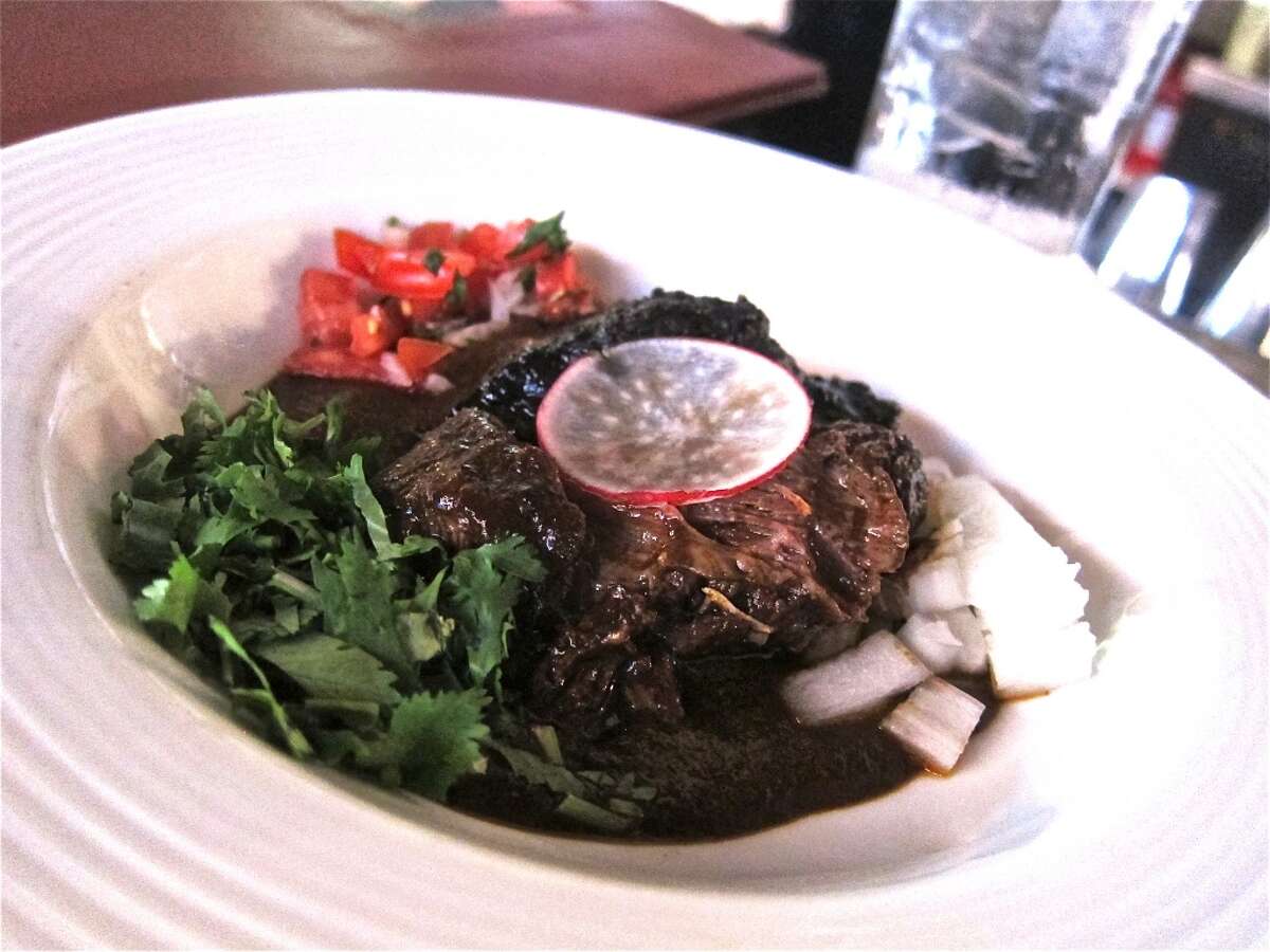 The cachetes de res (beef cheek) at Hugo's get an extra layer of complexity with the addition of a pasilla chile sauce.