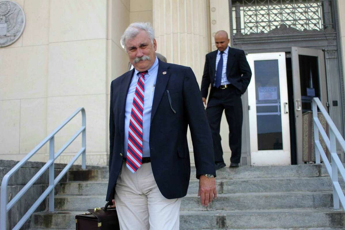 In this July 9, 2011 photo, U.S Attorney John Craft leaves the federal court building in Beaumont, Texas. On Wednesday, Aug. 14, 2013, officials said derogatory comments Craft made about President Barack Obama and Trayvon Martin on Facebook are being reviewed. (AP Photo/The Courier, Jason Fochtman)