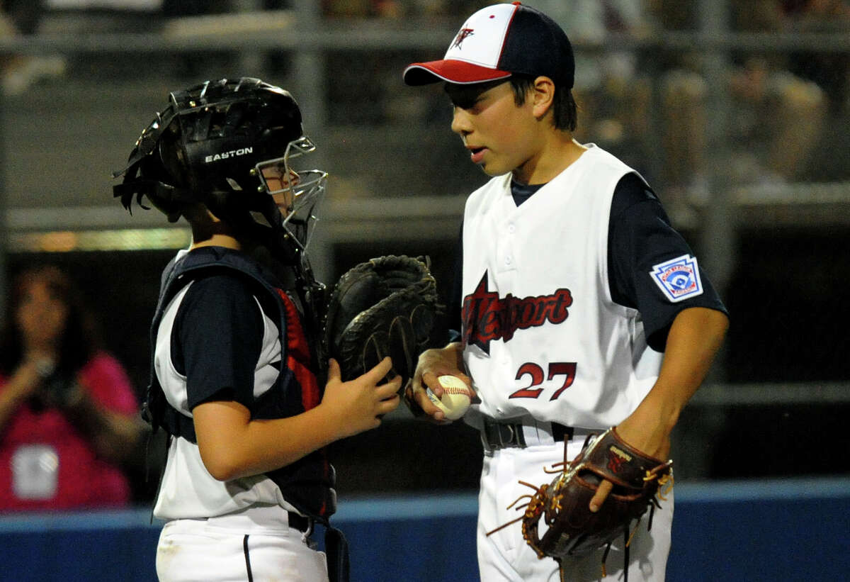 Westport's Chad Knight confers with catcher Matt Stone as he pitches against South Burlington, during Little League Baseball Eastern Regional Tournament action in Bristol, Conn. on Friday August 2, 2013.