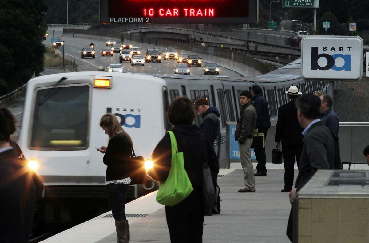BART trains and traffic flow as usual at the Rockridge station in Oakland, Calif., Monday, Aug. 5, 2013, after a late-night decision by Gov. Jerry Brown to stop the BART strike. Brown imposed a seven-day injunction and created a three-member panel to investigate the contract talks. (AP Photo/The Contra Costa Times,Laura A. Oda )