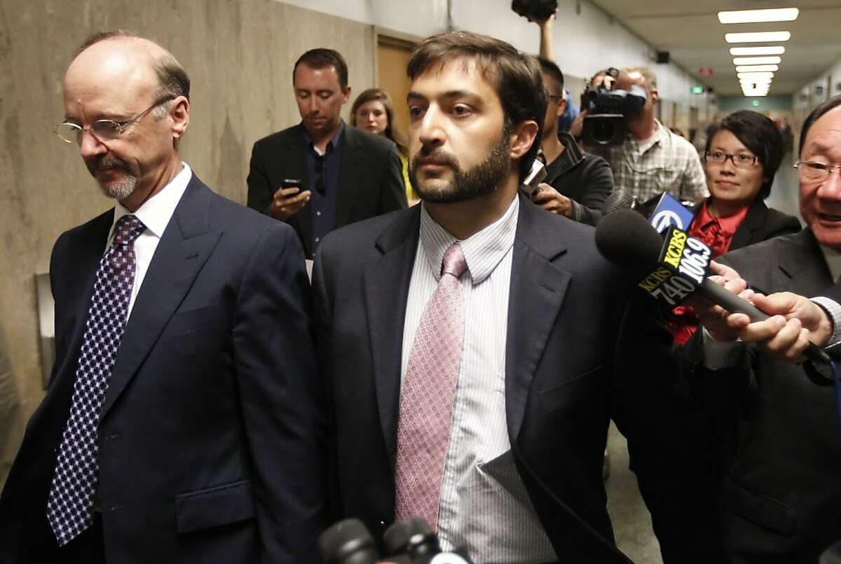 Christopher Bucchere, 37, leaving court with his attorney Ted Cassman, (left) after his sentencing on Thursday August 15, 2013, in San Francisco, Ca. Bucchere pled guilty to vehicular manslaughter, the first of its kind in the nation involving a bicycle.