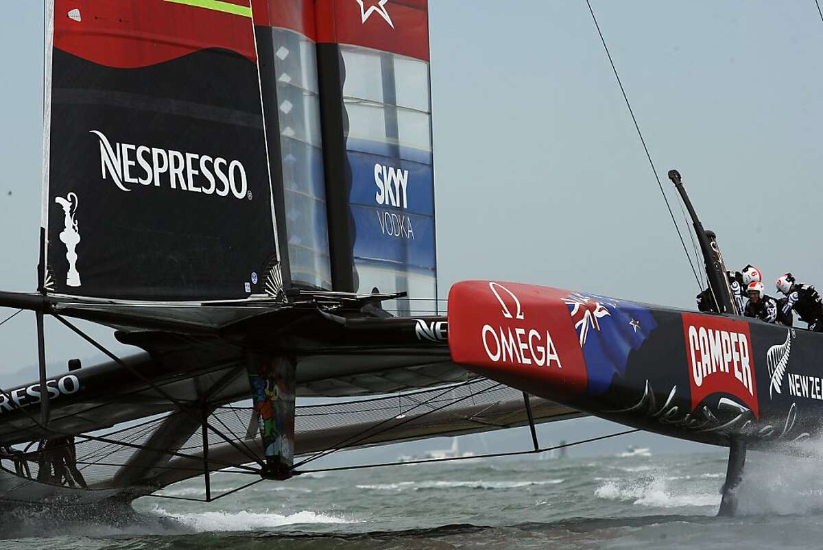 Emirates Team New Zealand cruised to victory over Team Luna Rossa in the first race of the finals of the Louis Vuitton Cup. However, two sailors wen overboard close to the finish as a result of a rip in their tarp on Saturday, August 17, 2013, in San Francisco, Calif.